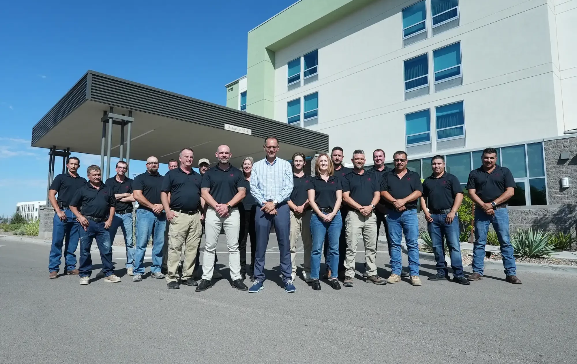 HSL Construction Services team standing outside of Springhill Suites.